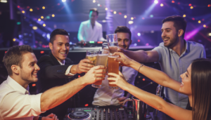 Group of friends celebrating a bachelor party with lively entertainment and a DJ set in a vibrant club atmosphere.